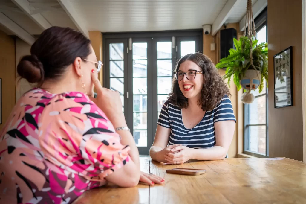 Sophie from Three Beams thinking with a client discussing business strategy